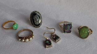 A Chinese jade and yellow metal dress ring, together with a pearl set ring, marcasite set ring,