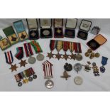 A set of five World War II medals, including The 1939-1945 Star, The Atlantic Star, The Burma Star,