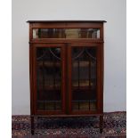 An Edwardian mahogany bijouterie display cabinet, with a hinged glazed top and sides,