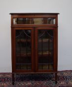 An Edwardian mahogany bijouterie display cabinet, with a hinged glazed top and sides,