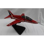 A Bravo Delta model of a BAE hawk T1 Red Arrows model, on a stand,