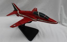 A Bravo Delta model of a BAE hawk T1 Red Arrows model, on a stand,