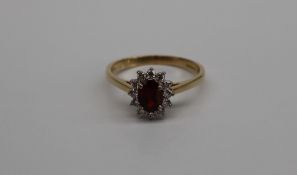 A garnet and diamond cluster ring,