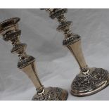 A pair of Elizabeth II silver candlesticks,