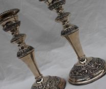 A pair of Elizabeth II silver candlesticks,