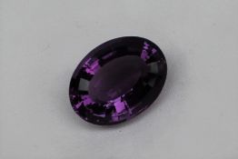 An unmounted amethyst, of oval faceted form, measuring approximately 21mm x 16mm, approximately 3.