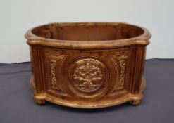 A large gilt decorated planter of rounded form with leaf pierced roundels on reeded circular feet,