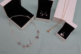 A Pandora bee necklace together with a Pandora necklace and charms,