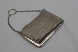 An Edward VII silver note case, with line decoration with an initialled circular cartouche,