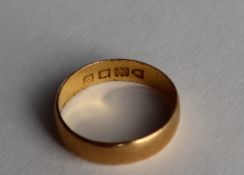 A 22ct yellow gold wedding band, approximately 1.