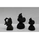 Three bronze opium weights, including a graduated pair in the form of ducks,