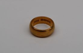 A 22ct yellow gold wedding band, size I, approximately 7.