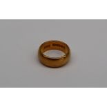 A 22ct yellow gold wedding band, size I, approximately 7.