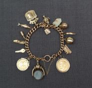 A 9ct yellow gold charm bracelet set with numerous charms including a George V gold sovereign dated