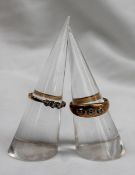 An 18ct yellow gold three stone diamond ring, size N,