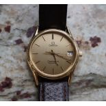A Gentleman's Omega Seamaster quartz wristwatch, the gilt dial with batons and a date aperture,