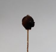 A hardstone stick pin,