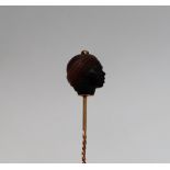 A hardstone stick pin,