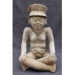 A precolumbian type figure of a "Smiling" figure or Sonrientes, nude from the waist up,
