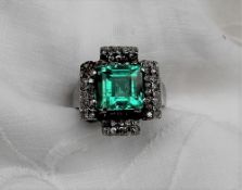 An Emerald and diamond ring,