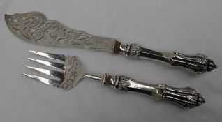 A pair of Victorian silver fish servers, the pierced blades to acanthus leaf capped loaded handles,