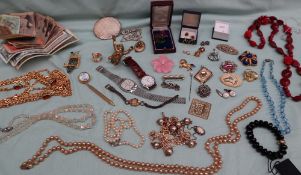 Assorted costume jewellery including brooches, Seiko wristwatches, earrings, beaded necklaces,