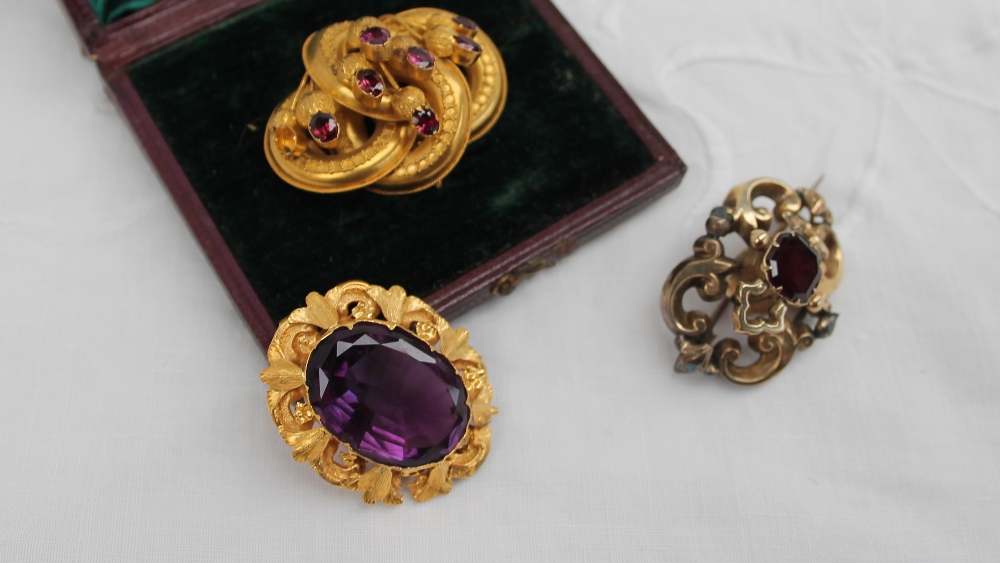 A Victorian brooch, set with a central faceted amethyst in a yellow metal mount, - Image 2 of 6