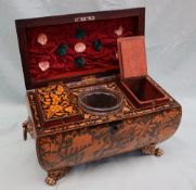 A Regency chinoiserie pen work decorated tea caddy of sarcophagus shape decorated all over with