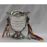 A George V silver trophy cup, with a pierced rim, tapering body,