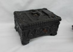 A Polish carved coal jewellery box, the top carved with a miner underground,