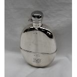A George V silver oval hip flask, with a captive top and cup base with monogram, Sheffield, 1924,
