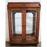 A late 19th / early 20th century French oak and ormolu display cabinet,