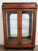 A late 19th / early 20th century French oak and ormolu display cabinet,