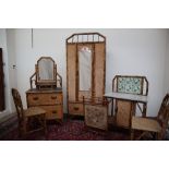 A six piece cane and bamboo bedroom furniture suite, comprising a single wardrobe, dressing chest,