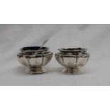 A pair of George V silver salts, of round lobed form to a spreading foot, Messrs Barnard, 1912,