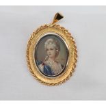 An 18ct yellow gold brooch / pendant with a head and shoulders portrait miniature inset,