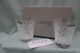 A pair of Lalique glass beakers, embossed with flowers, inscribed "Lalique (R) France,