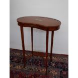 An Edwardian satinwood occasional table of kidney shape,