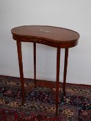 An Edwardian satinwood occasional table of kidney shape,