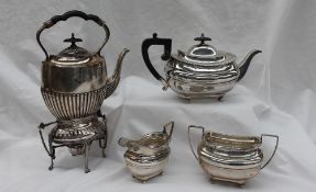 A George V silver three piece teaset, comprising a teapot, twin handled sugar basin and a cream jug,