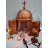 A Brass altar tabernacle, with a cross atop the dome,