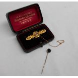 A Victorian 15ct yellow gold bar brooch, set with a sapphire, ruby and diamond, approximately 3.