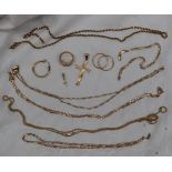 Assorted 14ct gold jewellery including necklaces, cross pendants, earrings and a gem set ring,