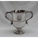 A George II two handled loving cup, of slight baluster form to a spreading foot,