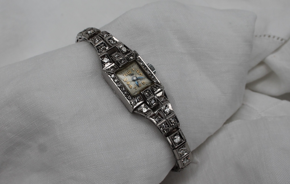 An Art Deco diamond set cocktail watch,