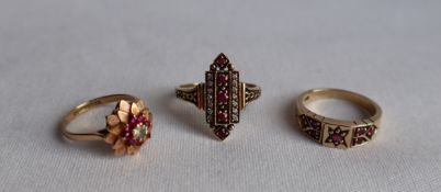 A 9ct yellow gold ruby ring, set with seven round faceted rubies, to a claw setting and shank,