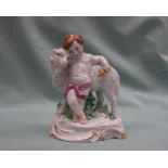 A Meissen porcelain figure of a child and a lamb, underglaze blue crossed swords mark to the base,