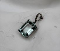 An aquamarine pendant, the emerald cut stone measuring approximately 20mm x 16mm,