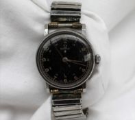 An Omega stainless steel military wristwatch, with a black dial,.