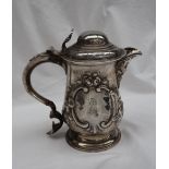 A George III silver tankard with a domed cover,